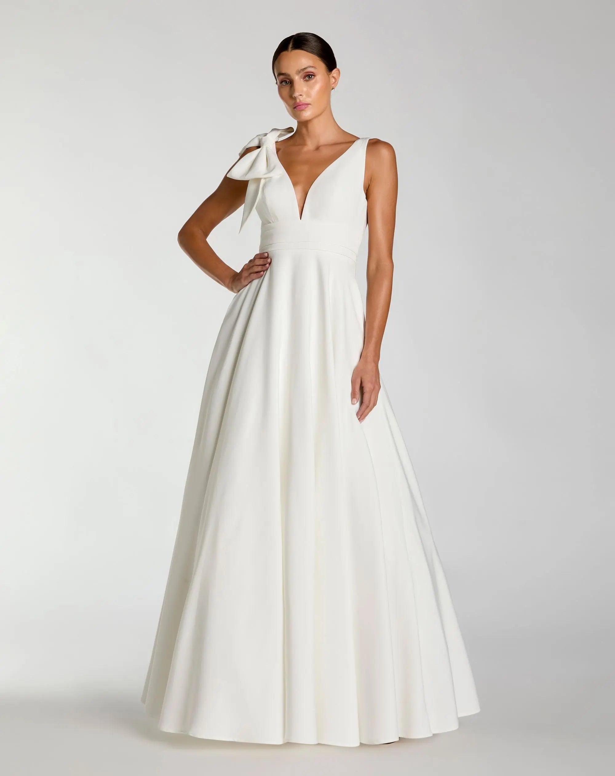 Sleeveless Plunge Neck Ball Gown With Bow Detail